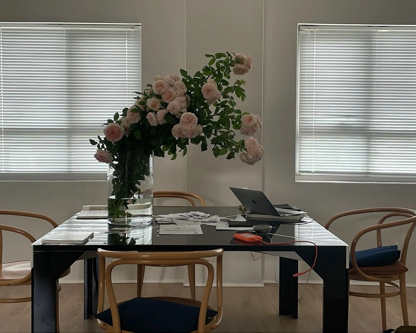 Floral installation extending across a studio table
