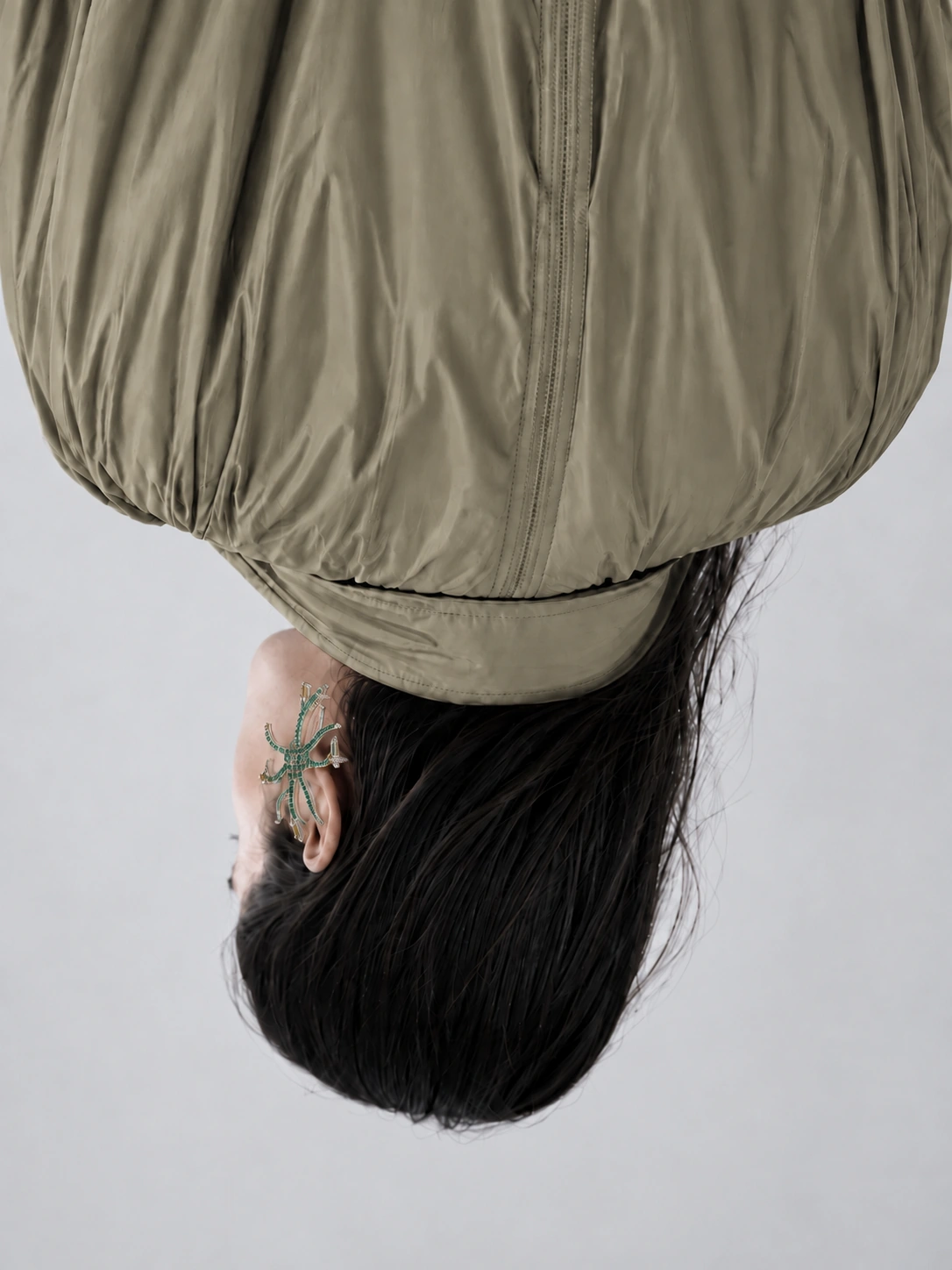 Subtle Senses study — inverted portrait and sculptural outerwear